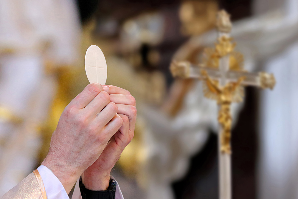 Priest celebrating Mass At Church